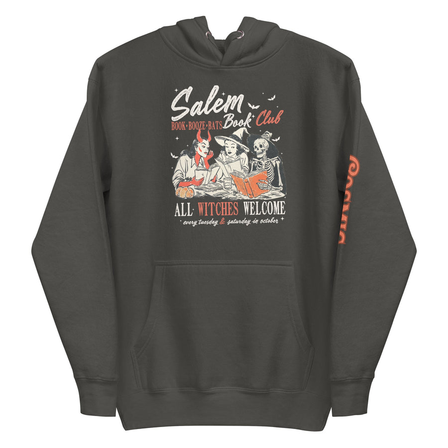 Salem Book Club hoodie in vintage black — three witches reading by candlelight above the words All Witches Welcome, with a sleeve print