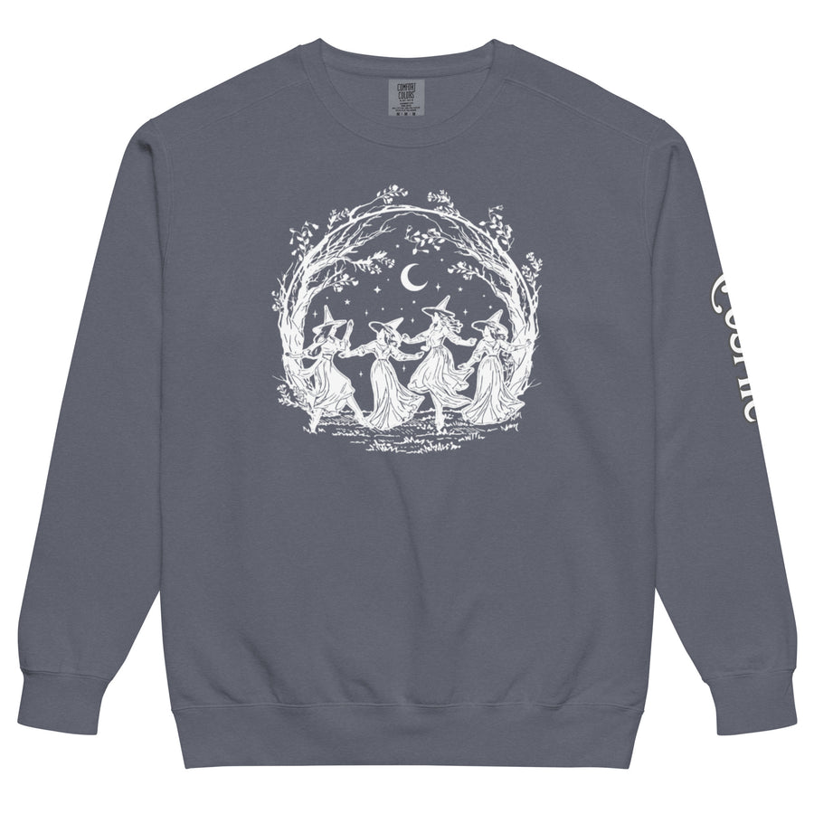 Witchy garment-dyed sweatshirt — ring of witches dancing under an arch of bare trees. Unisex graphic sweatshirt, a great witchy gift.