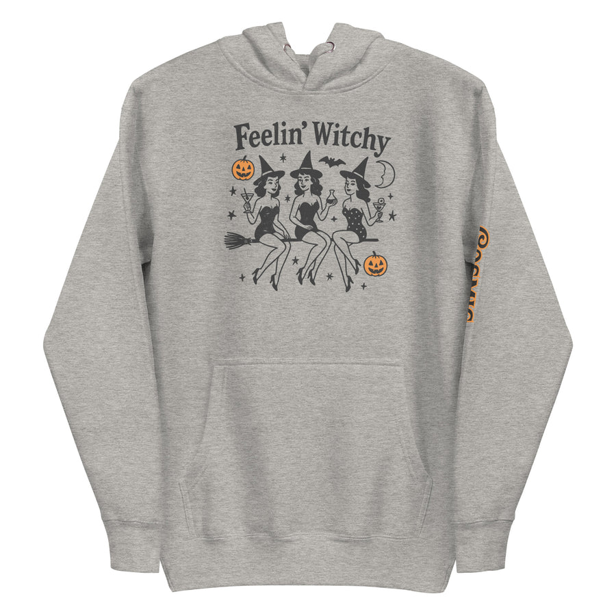 Witchy Halloween hoodie — 'Feelin' Witchy' script above three witches on brooms. Unisex graphic hoodie, a great witchy gift.