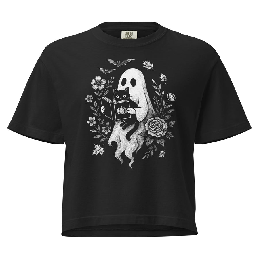 Bookish ghost boxy tee — ghost reading a book aloud to a black cat, framed. Women's graphic t-shirt, a great book-lover gift.