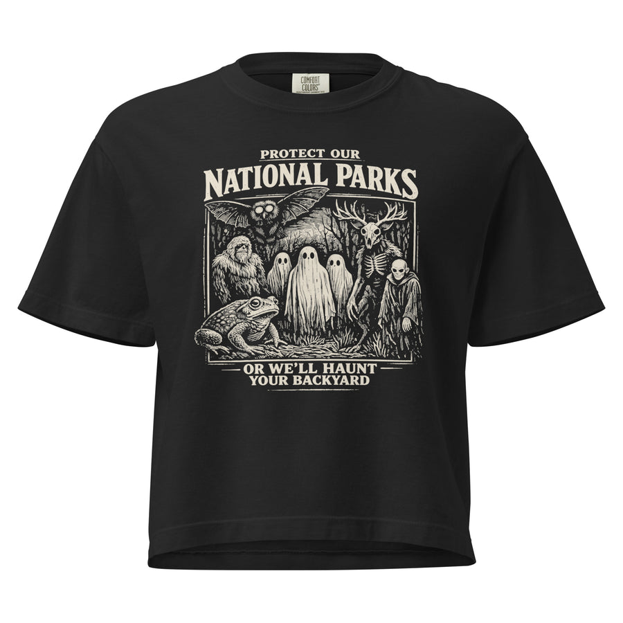 Black women's boxy Protect Our National Parks tee with a cream woodcut cryptid coalition graphic